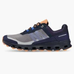 On Running Women's Cloudvista Trail Shoe - Midnight/Copper- Regular (B) -Sport Footwear Shop 64.98592 cloudvista fw22 midnight copper w g4